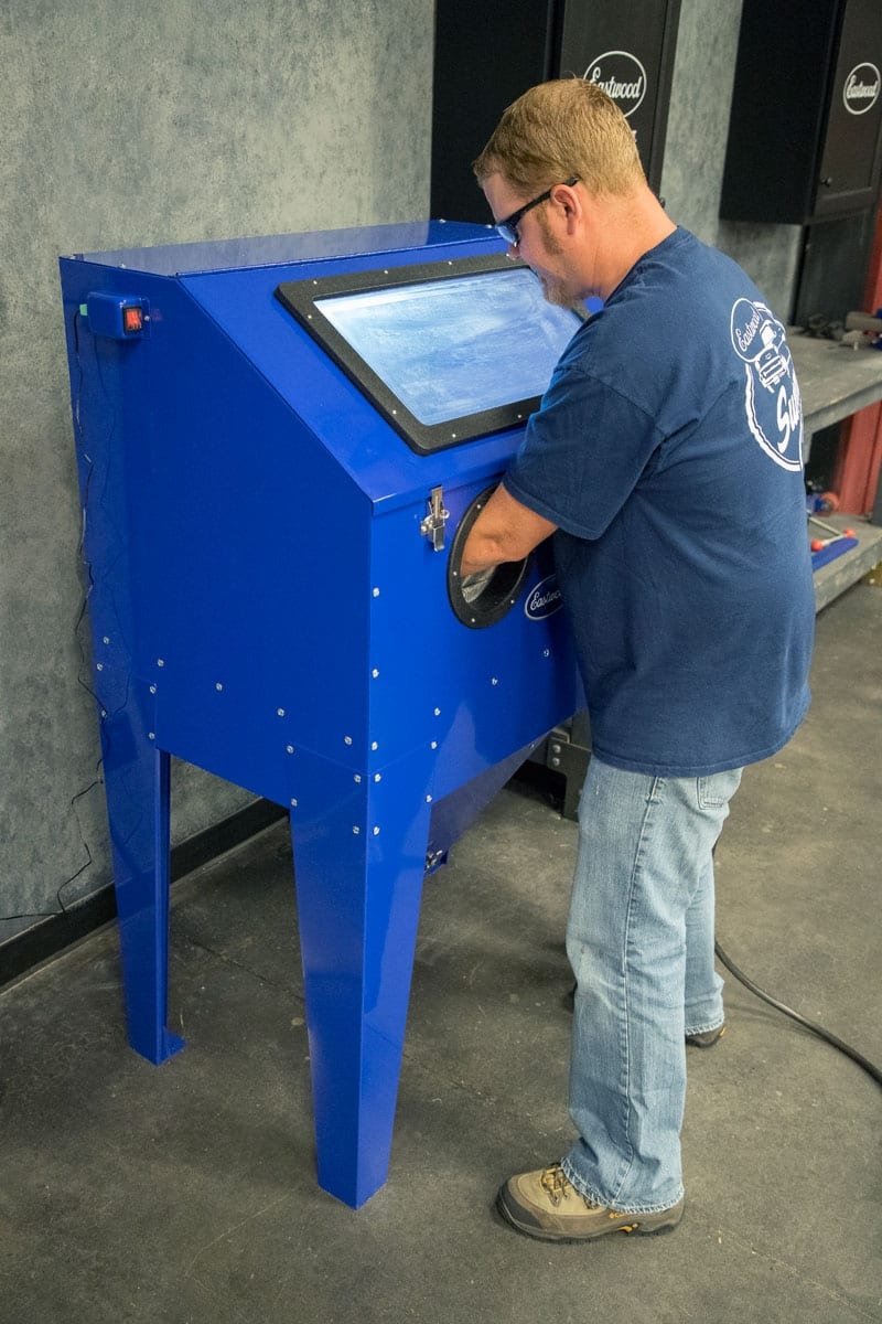 Eastwood B60 blast cabinet in use showing the front window and glove port
