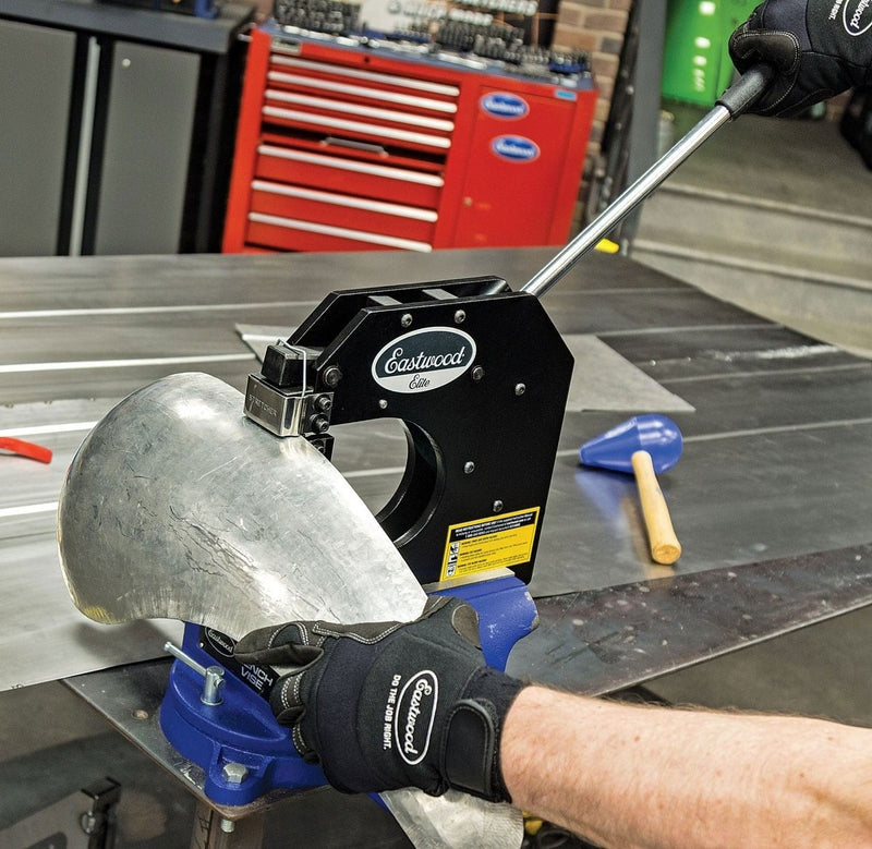 Eastwood Elite shrinker stretcher forming a curved metal panel in a shop